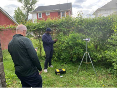 Weather station in grassy yard in Baltimore City